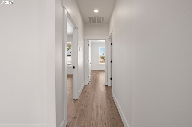 hall with light hardwood / wood-style flooring