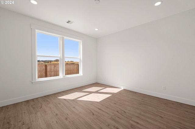 unfurnished room featuring light wood-type flooring