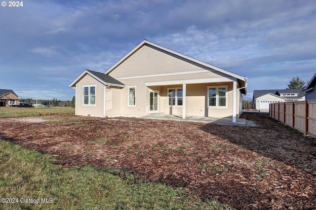 rear view of house featuring a patio