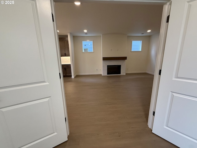 unfurnished living room with hardwood / wood-style flooring