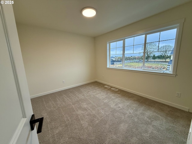 empty room with carpet flooring