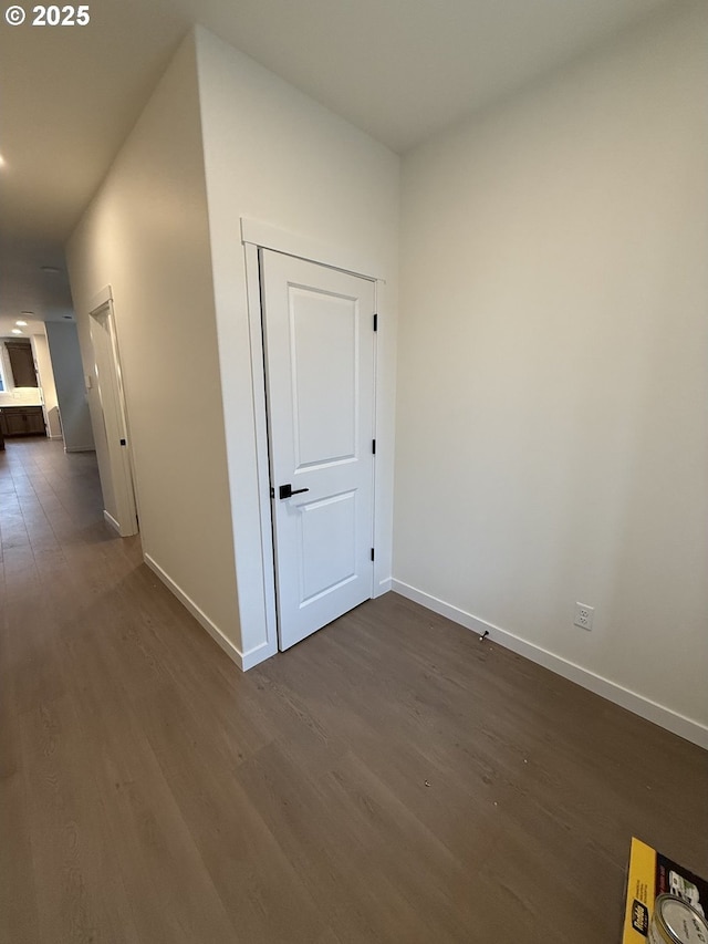 hall with dark hardwood / wood-style floors