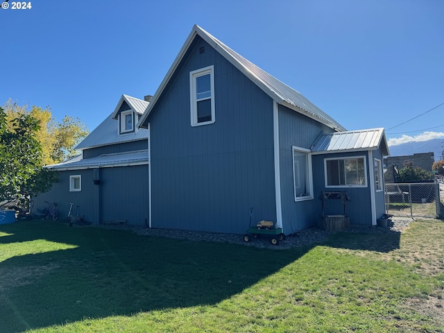 view of side of home featuring metal roof