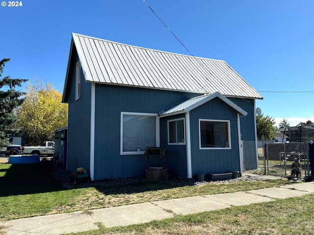 view of side of property with metal roof
