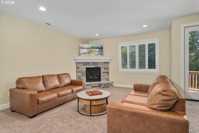 living room featuring a fireplace, carpet, visible vents, recessed lighting, and baseboards