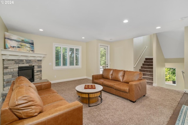 living area with baseboards, recessed lighting, and stairway