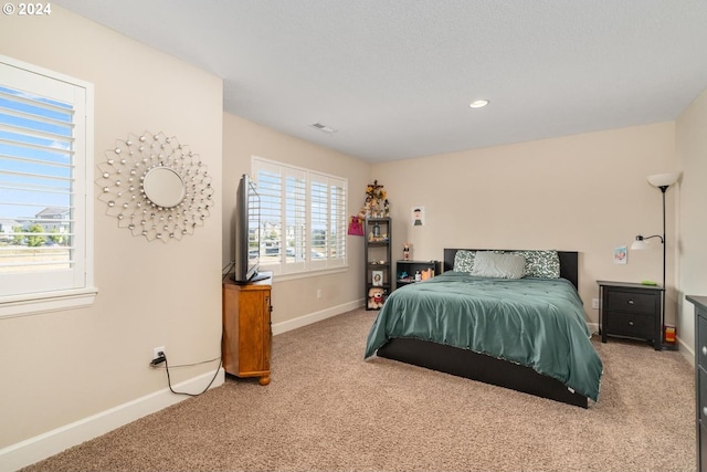 bedroom featuring recessed lighting, carpet flooring, visible vents, and baseboards