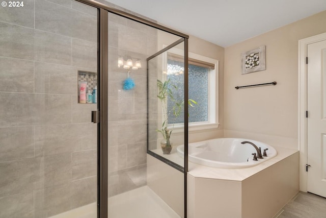 full bath with a garden tub and a stall shower