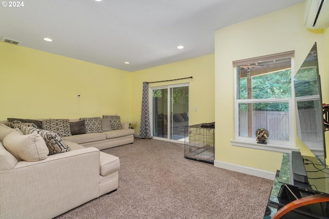 living room featuring a wall mounted air conditioner, carpet flooring, visible vents, and recessed lighting