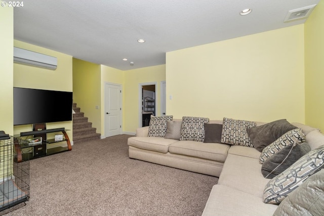 living room with a textured ceiling, a wall mounted air conditioner, and carpet flooring