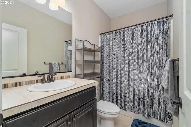 bathroom featuring vanity, walk in shower, toilet, and tile patterned floors