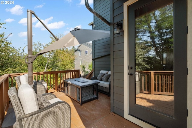 wooden terrace featuring outdoor lounge area