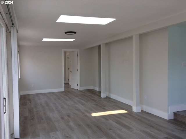 unfurnished room with hardwood / wood-style floors