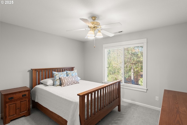 bedroom featuring light colored carpet and ceiling fan