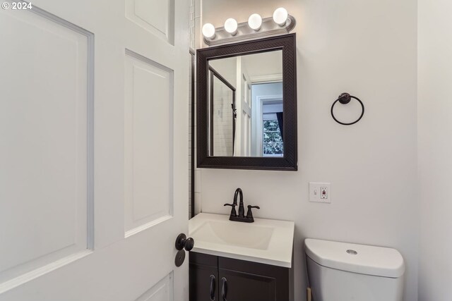 bathroom with toilet and vanity