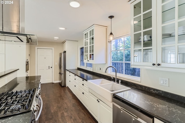 kitchen with pendant lighting, dark wood-type flooring, white cabinetry, appliances with stainless steel finishes, and extractor fan