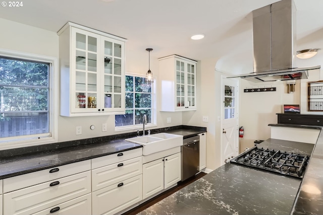 kitchen featuring island range hood, stainless steel dishwasher, sink, white cabinets, and hanging light fixtures