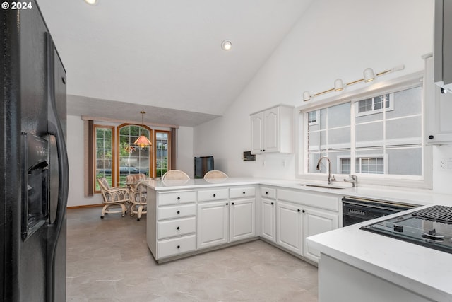 kitchen featuring black appliances, kitchen peninsula, sink, high vaulted ceiling, and white cabinetry