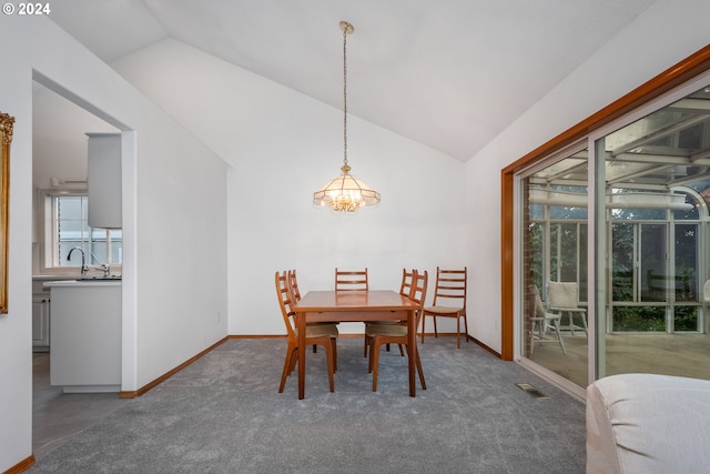 dining room featuring lofted ceiling and a chandelier