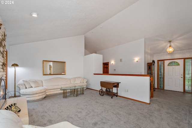 carpeted living room featuring high vaulted ceiling