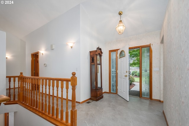 entryway featuring high vaulted ceiling