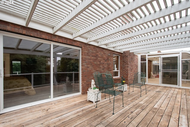 wooden deck featuring a pergola