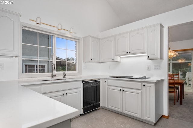 kitchen with white cabinets, dishwasher, gas stovetop, sink, and lofted ceiling