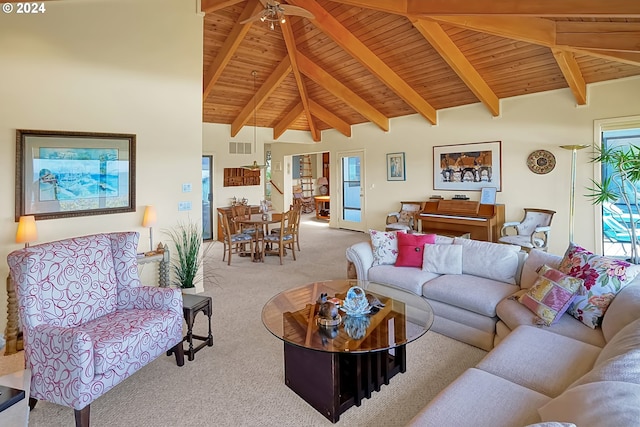 carpeted living room with visible vents, beamed ceiling, and wooden ceiling