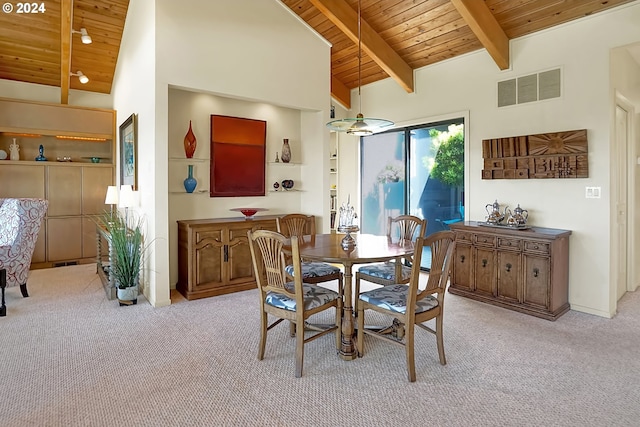 dining space with visible vents, light carpet, beamed ceiling, and wooden ceiling