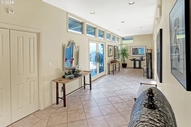 entryway with light tile patterned floors, french doors, and recessed lighting