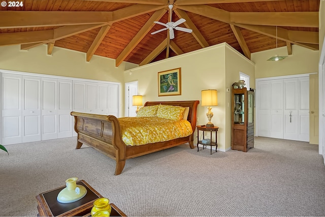 bedroom featuring beamed ceiling, wood ceiling, and carpet flooring