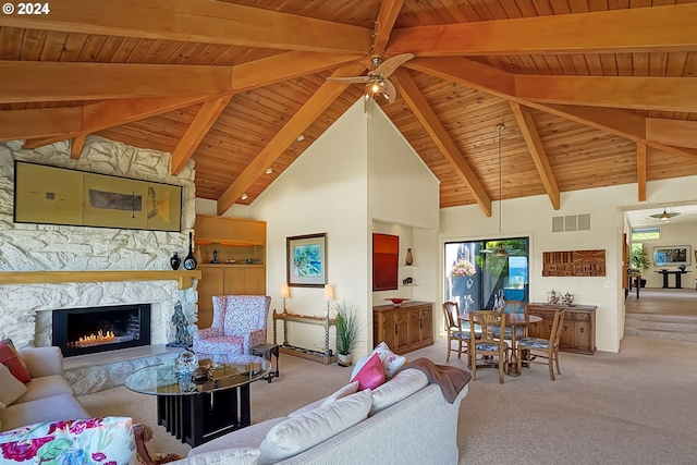 carpeted living area featuring a ceiling fan, visible vents, high vaulted ceiling, a stone fireplace, and wood ceiling