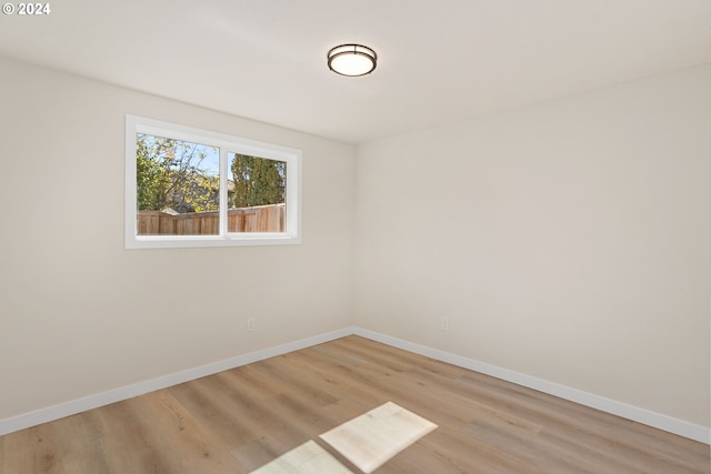 spare room with light wood-type flooring