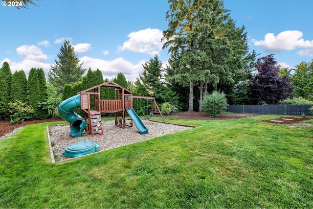 view of playground with a yard