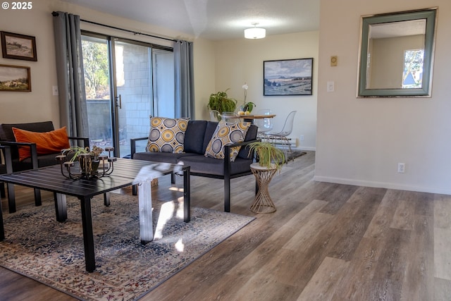 living room with hardwood / wood-style floors and a textured ceiling