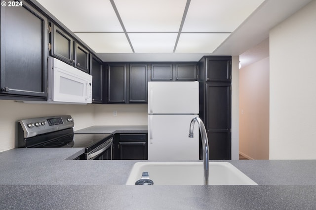 kitchen with sink and white appliances