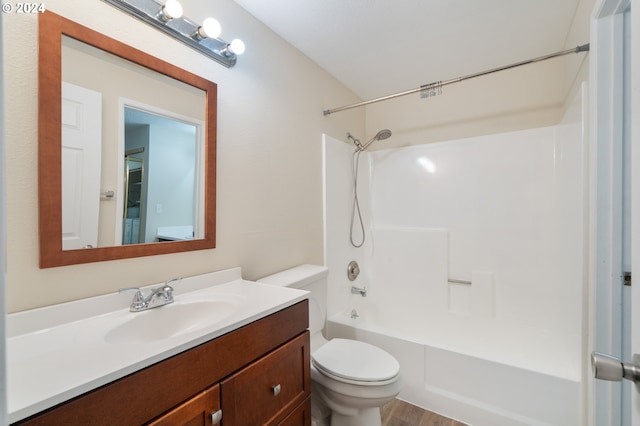 full bathroom featuring hardwood / wood-style flooring, shower / tub combination, vanity, and toilet