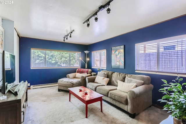 living room featuring track lighting and a baseboard radiator