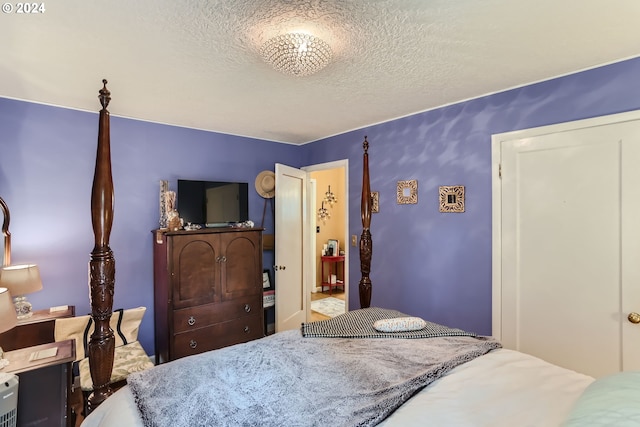 bedroom featuring a textured ceiling