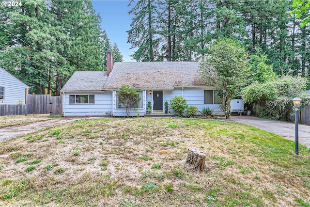 ranch-style house with a front lawn