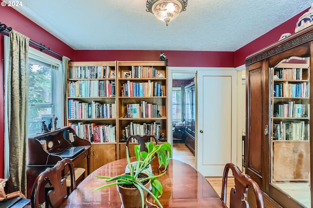 interior space featuring a textured ceiling and hardwood / wood-style flooring