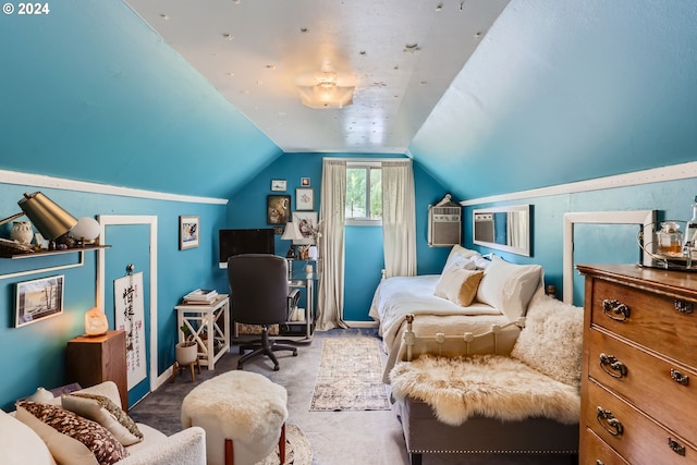 bedroom with vaulted ceiling and carpet floors