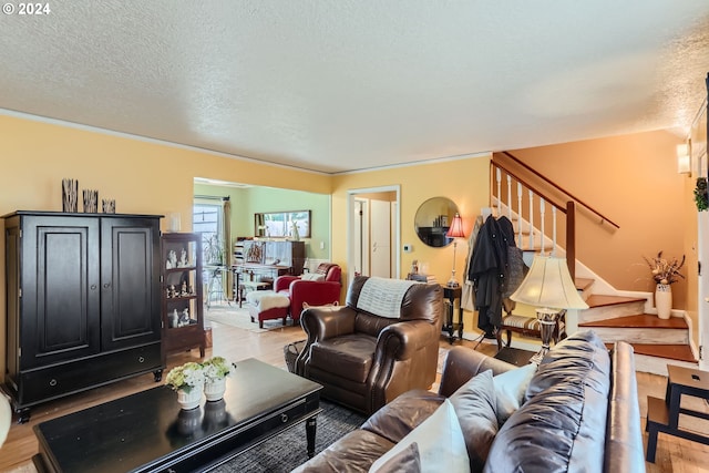 living room with a textured ceiling and hardwood / wood-style flooring