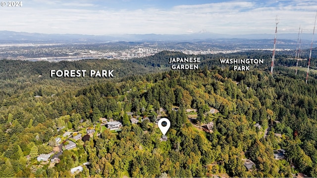 637 NW Skyline Crest Rd, Portland, OR 97229 - aerial view of property's location featuring a heavily wooded area and a mountainous background