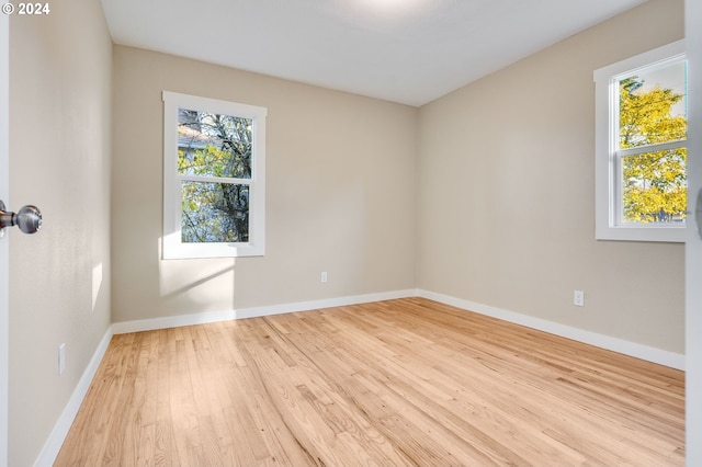 spare room featuring light hardwood / wood-style floors