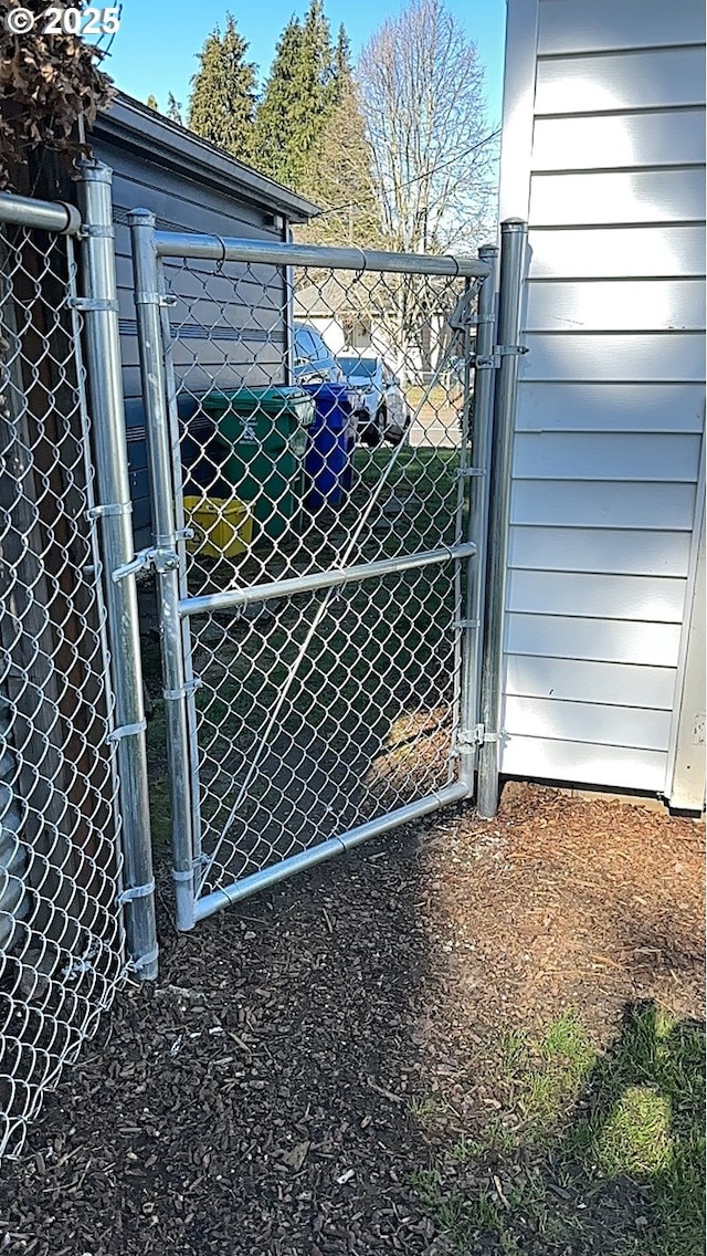 view of gate with fence