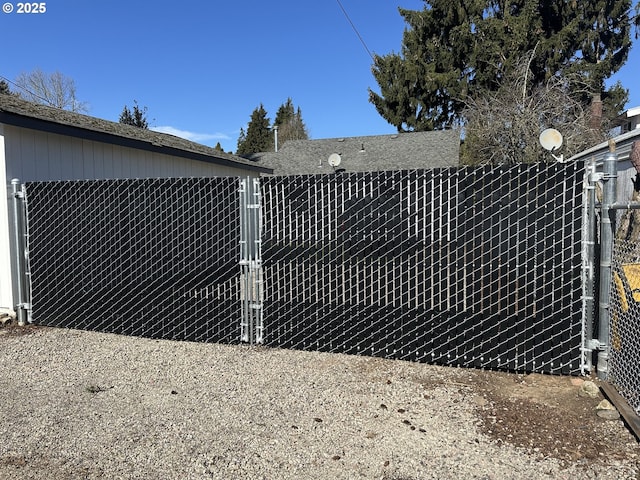 view of gate with fence
