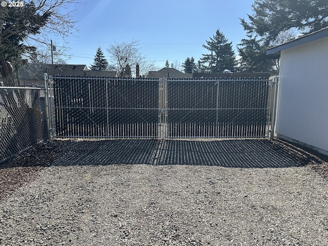 view of gate with fence