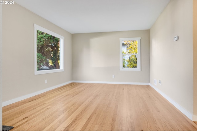 spare room featuring light wood-type flooring