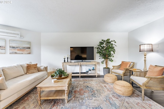 living room featuring hardwood / wood-style flooring and a wall unit AC